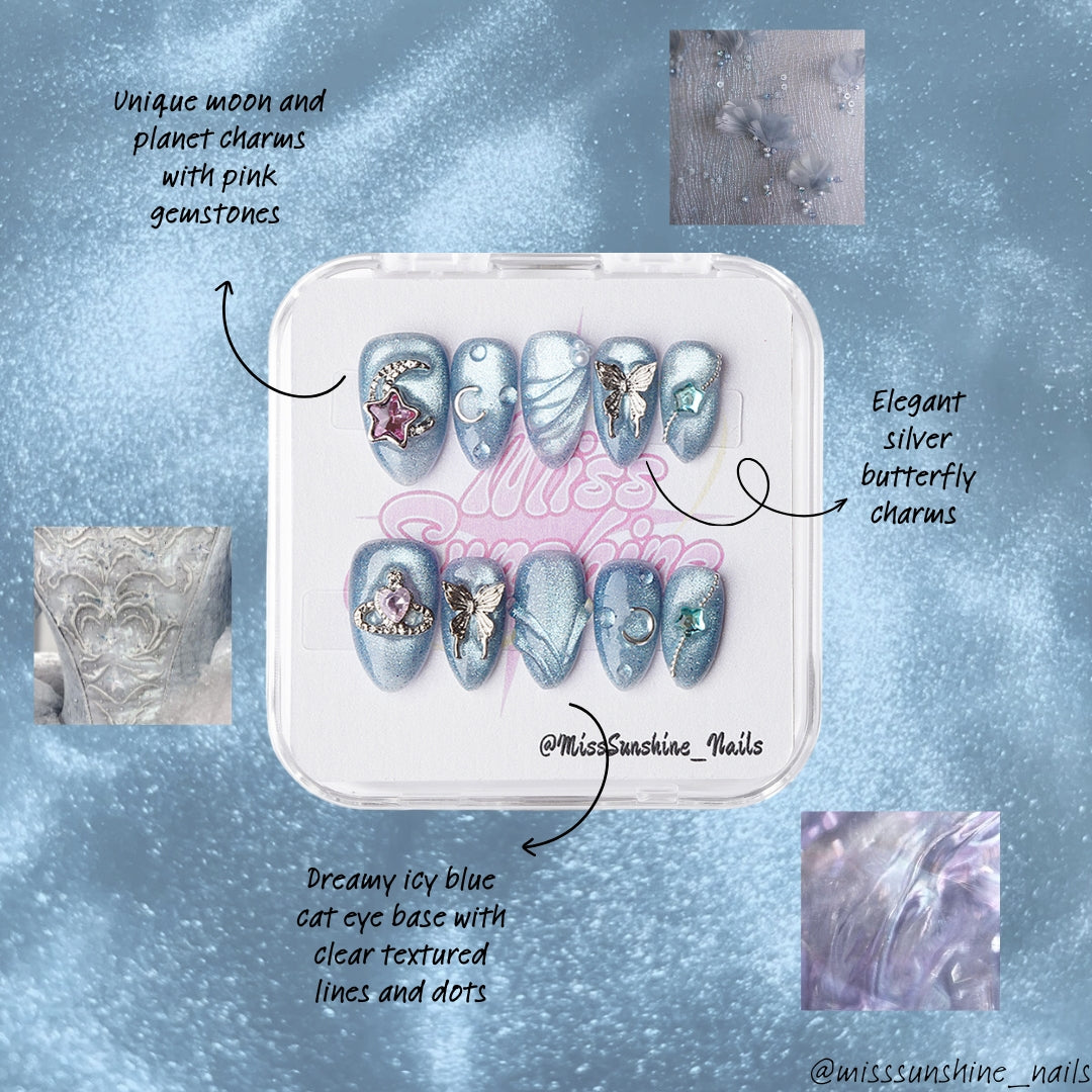 Extra Short almond blue nail set with cat-eye glow, moon charms, and butterfly embellishments
