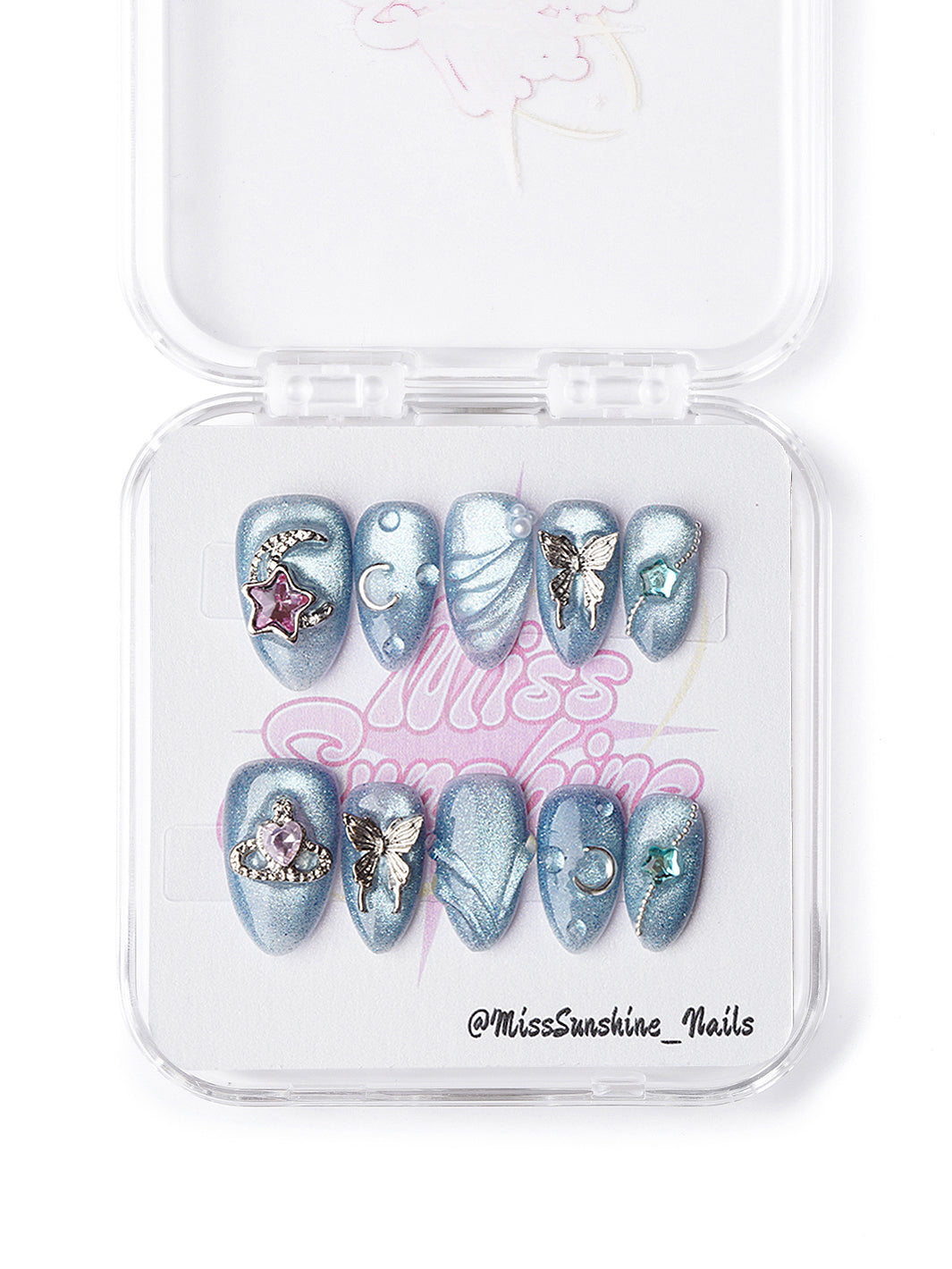 Blue celestial extra short press-on nails featuring sculpted textures and gemstone accents