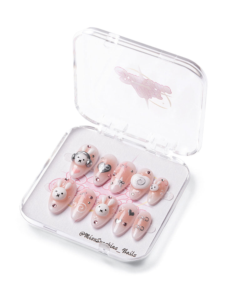 Pink nails with bunny and heart accents