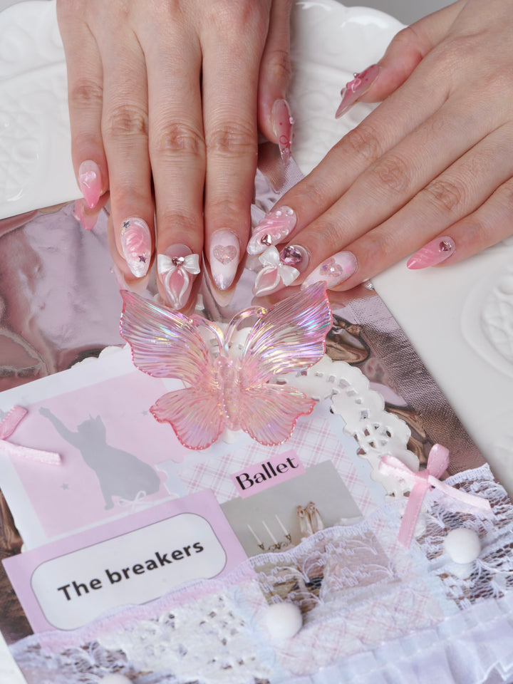 Pink nails with 3D bows and hearts