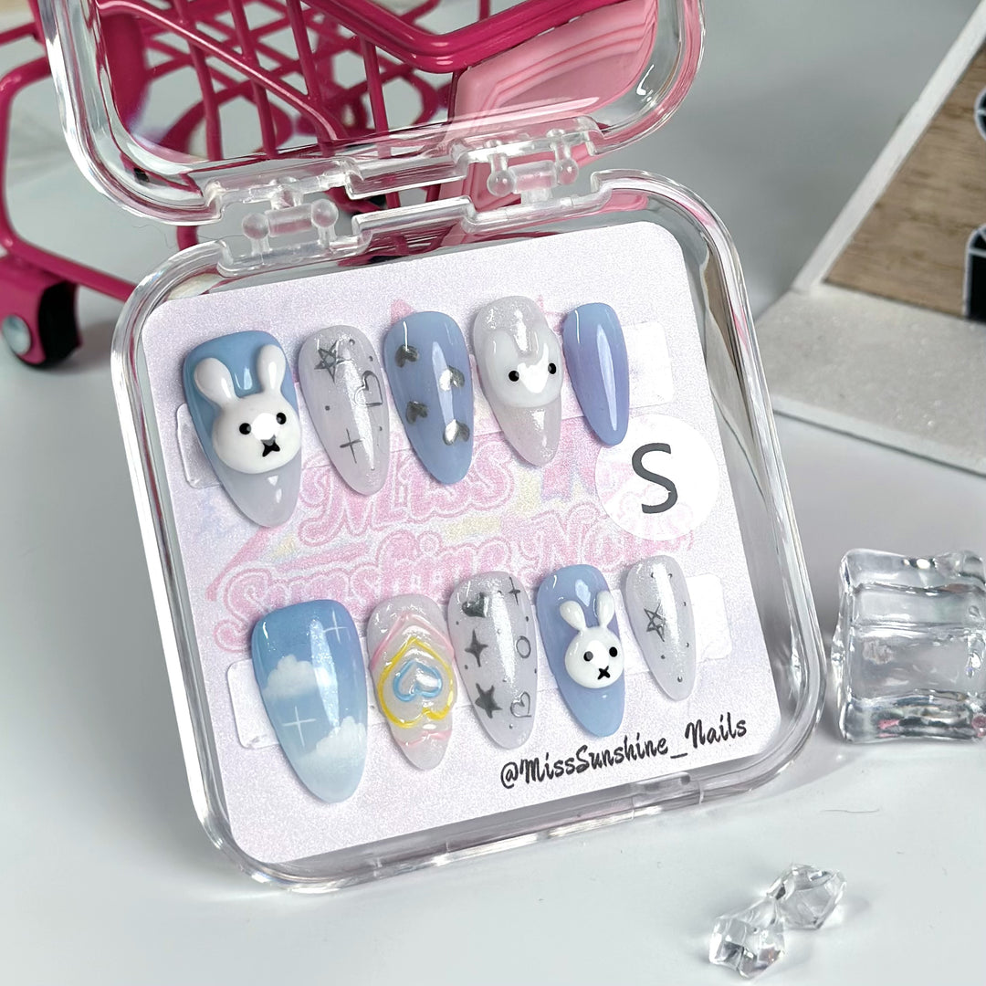 Navy nude nails with bunny heart design