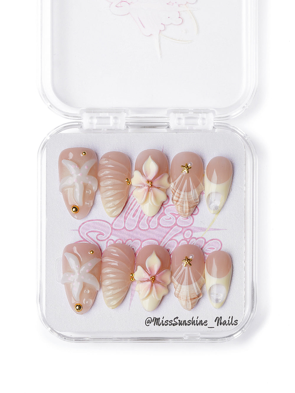 Creamy nude press-on nails with seashell textures and 3D flowers in short almond shape