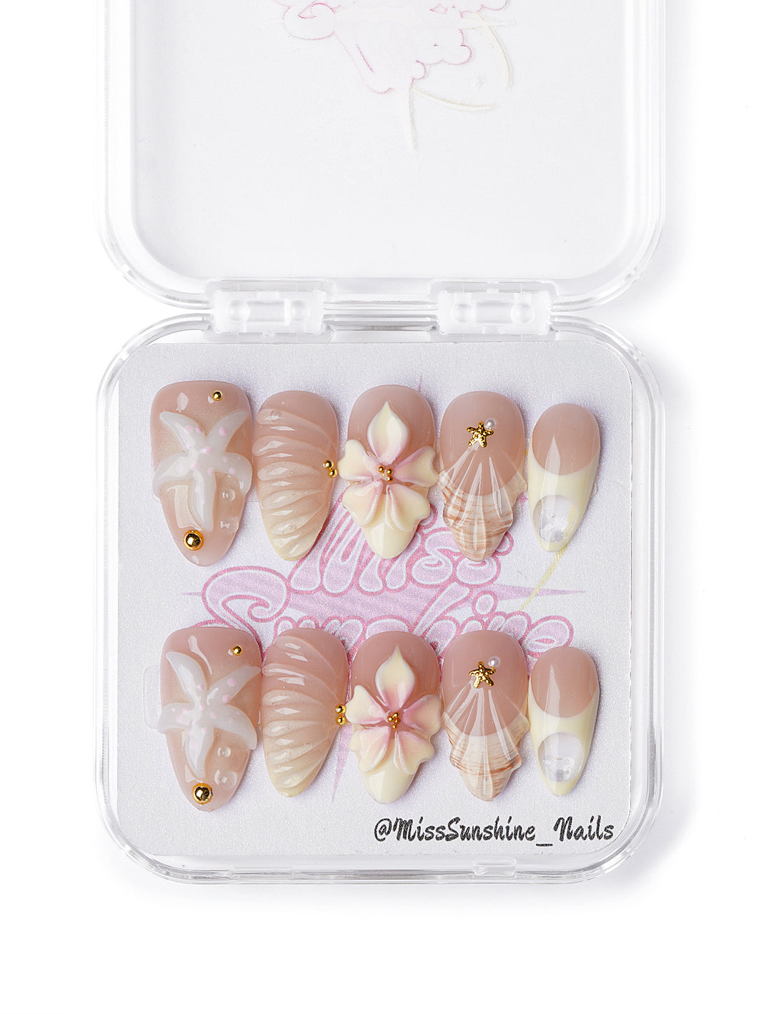 Creamy nude press-on nails with seashell textures and 3D flowers in short almond shape