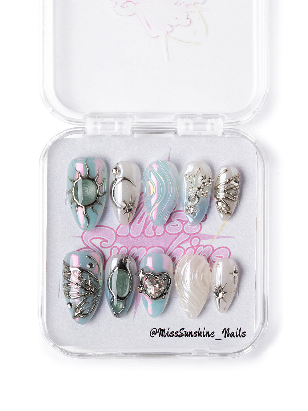 Icy opal-inspired winter nail set featuring marbled pastels, metallic silver designs, and star embellishments