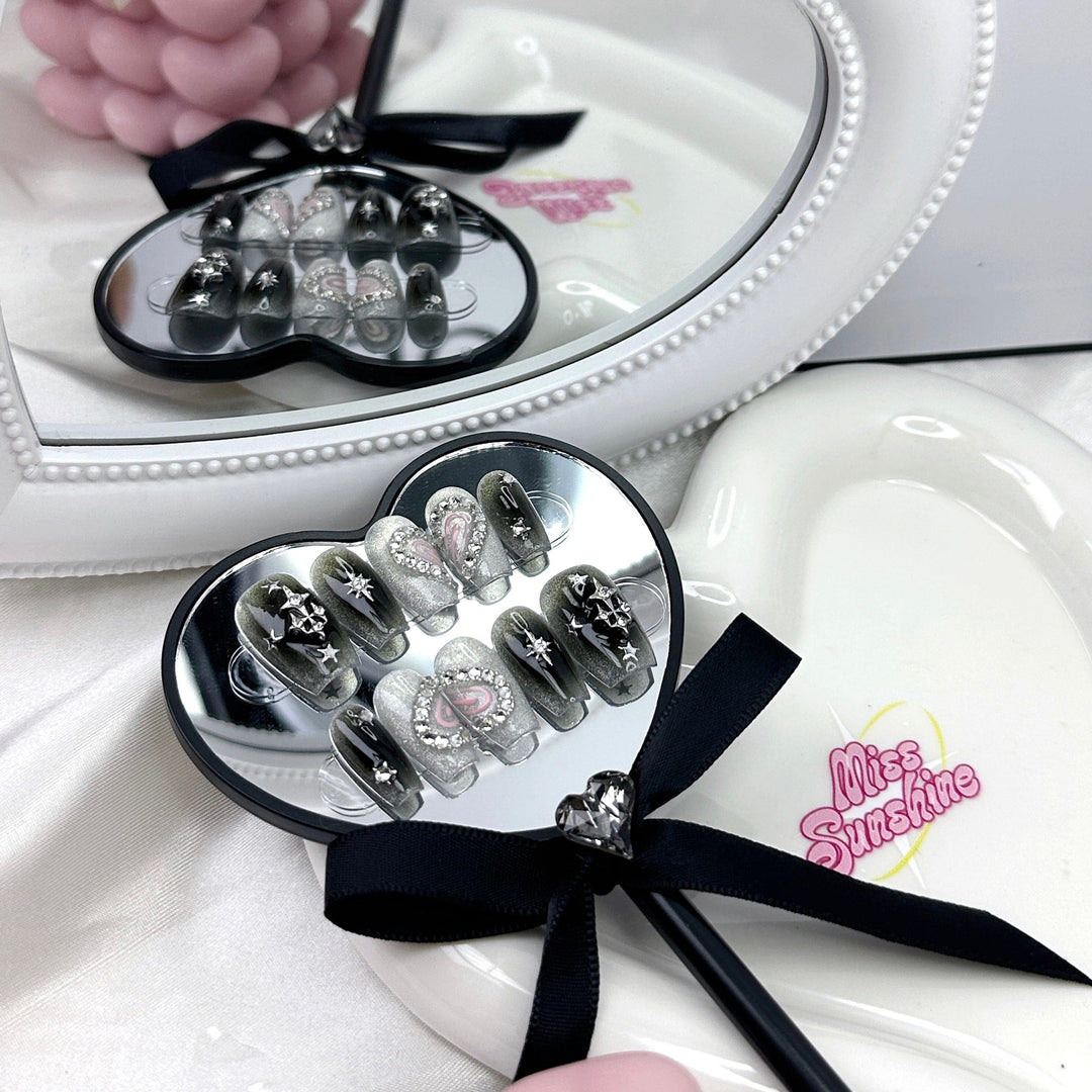 Black silver cat-eye nails with heart design