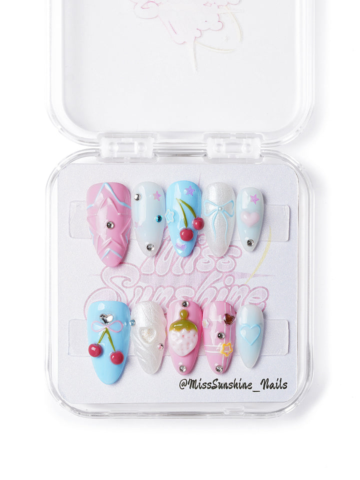  Kawaii-style handmade press-on nails featuring cherry art, iridescent swirls, and cute symbols in glossy pastel tones