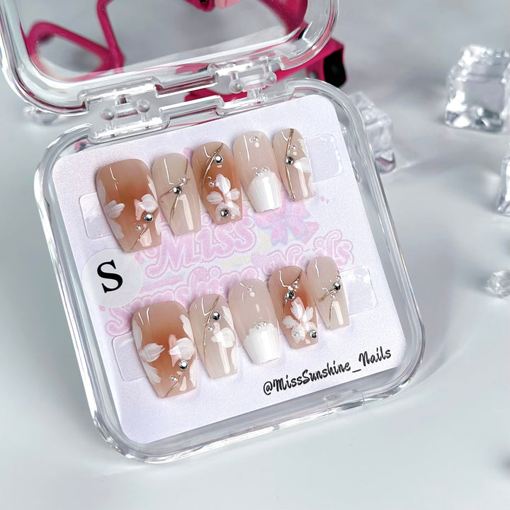 Elegant bridal nails with chrome base and pearls