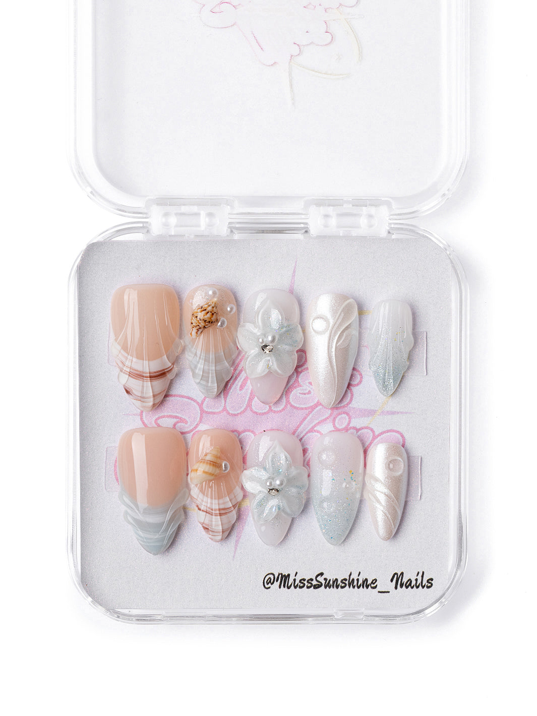 Pearl Tide press-on nails featuring 3D seashell charm detail