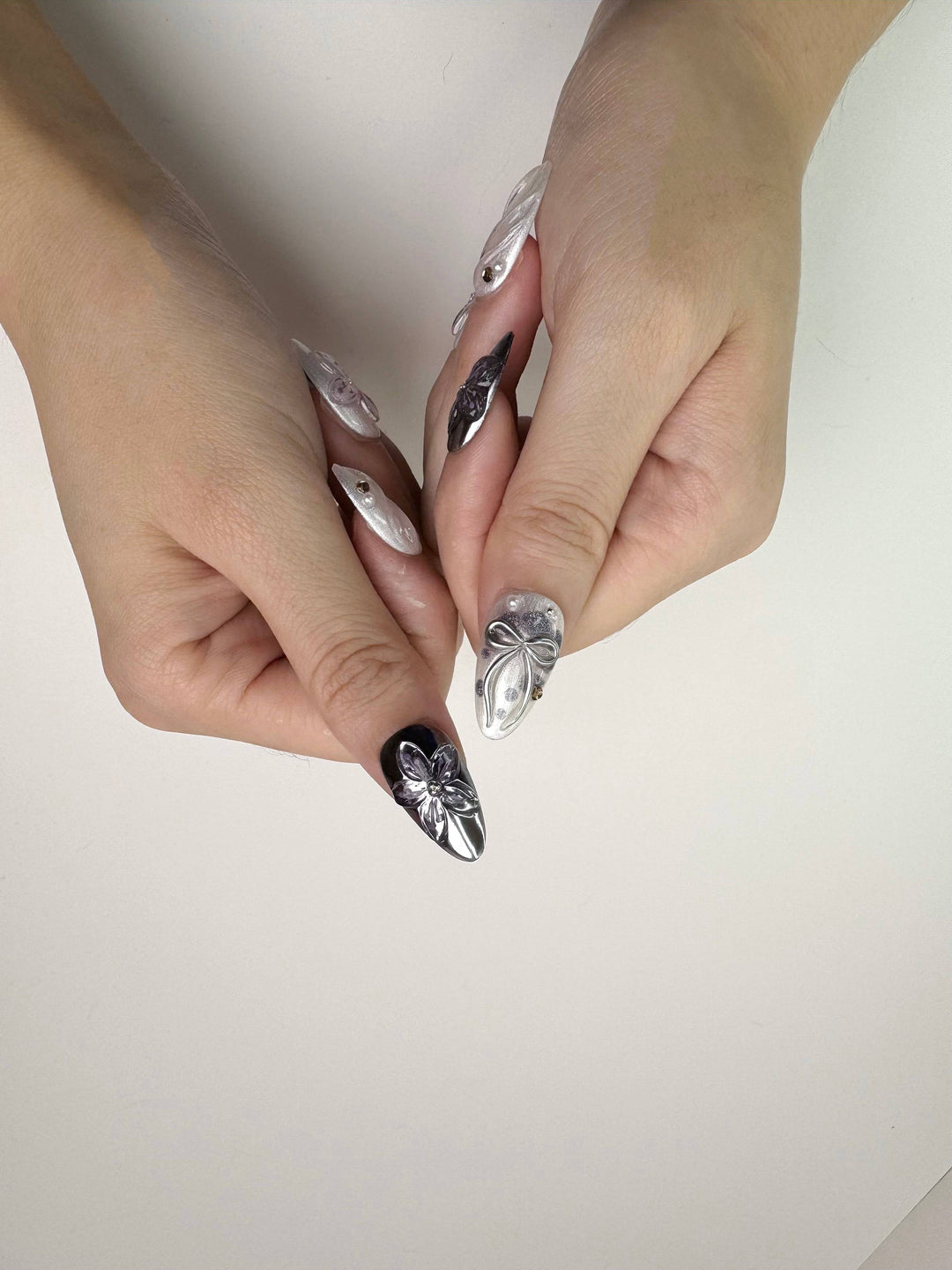 Elegant 3D flower design on chrome nails