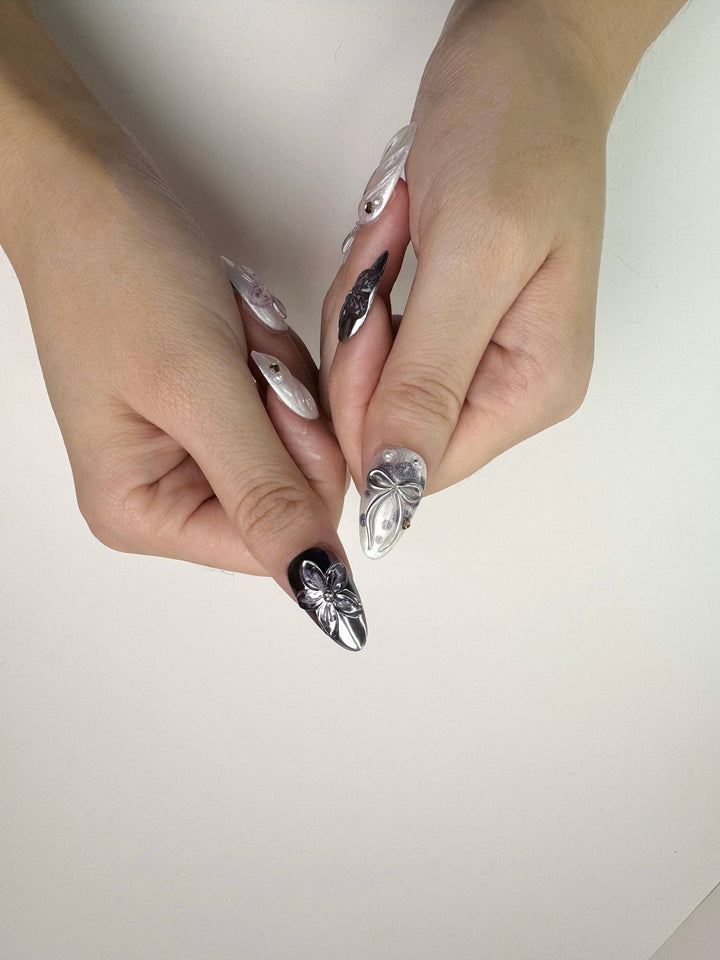 Elegant 3D flower design on chrome nails
