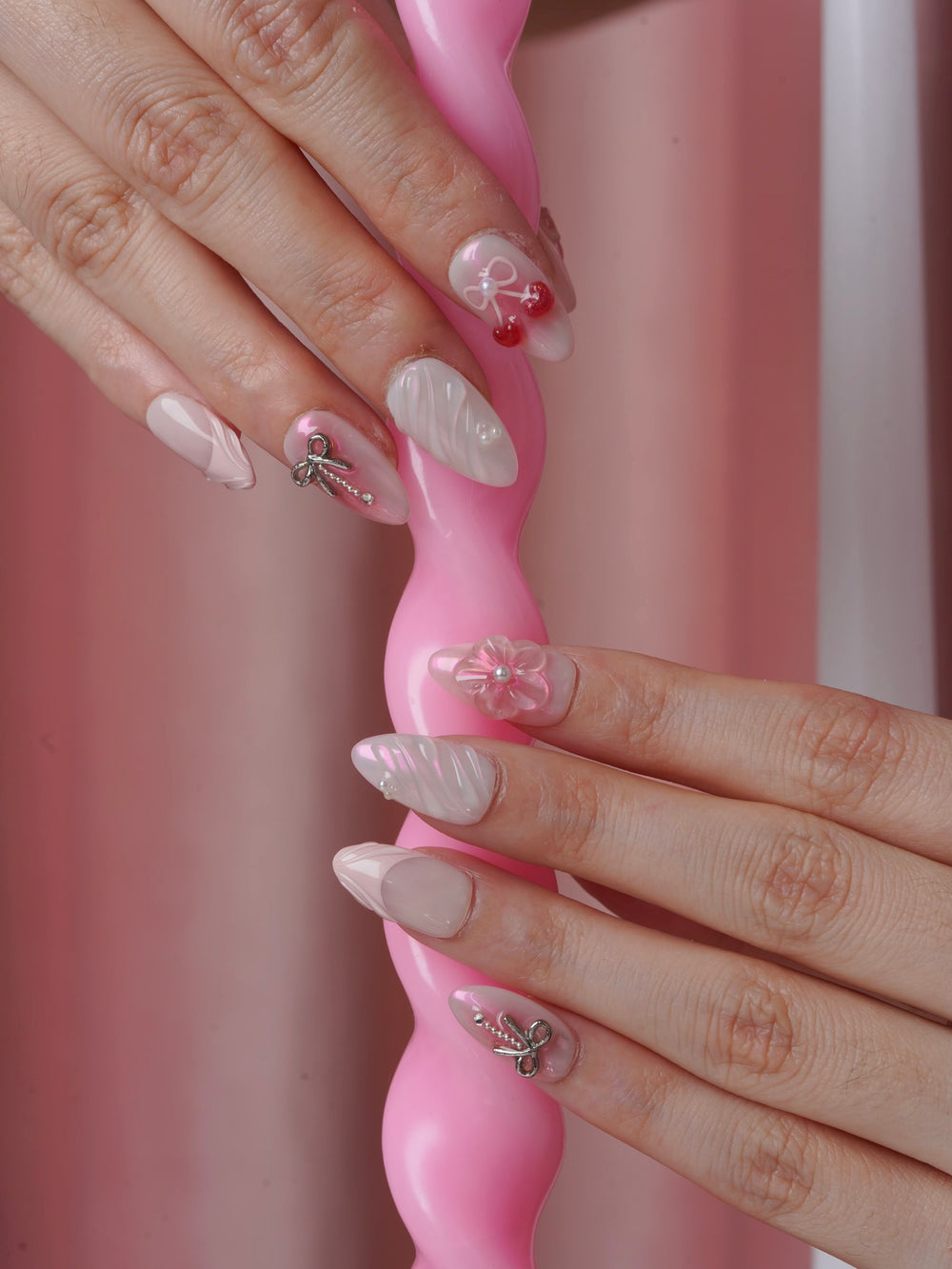 Extra short almond nails with bows