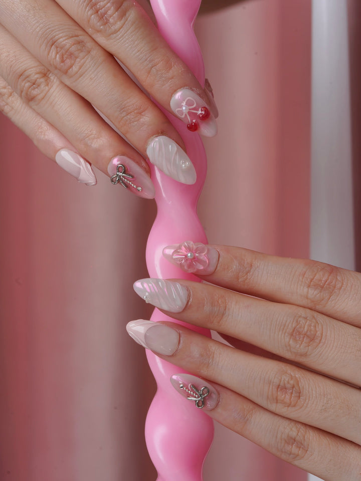 Extra short almond nails with bows
