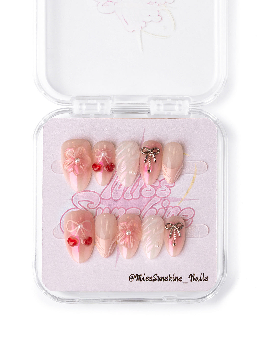 Valentine’s Day press-on nails in soft pink with elegant floral and pearl designs, perfect for a romantic look.