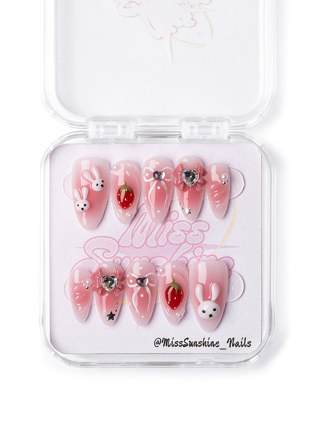 Cute pink handmade bunny nails with spring charm and bows