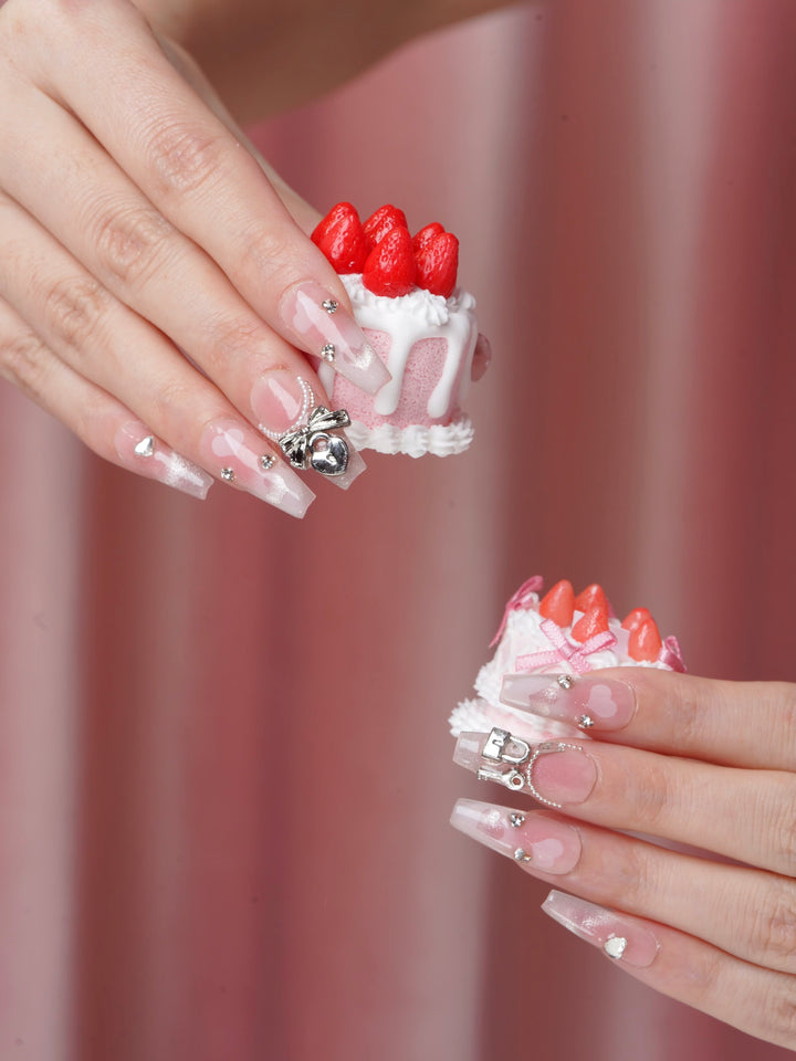 Valentine’s nails with silver heart and pearl designs