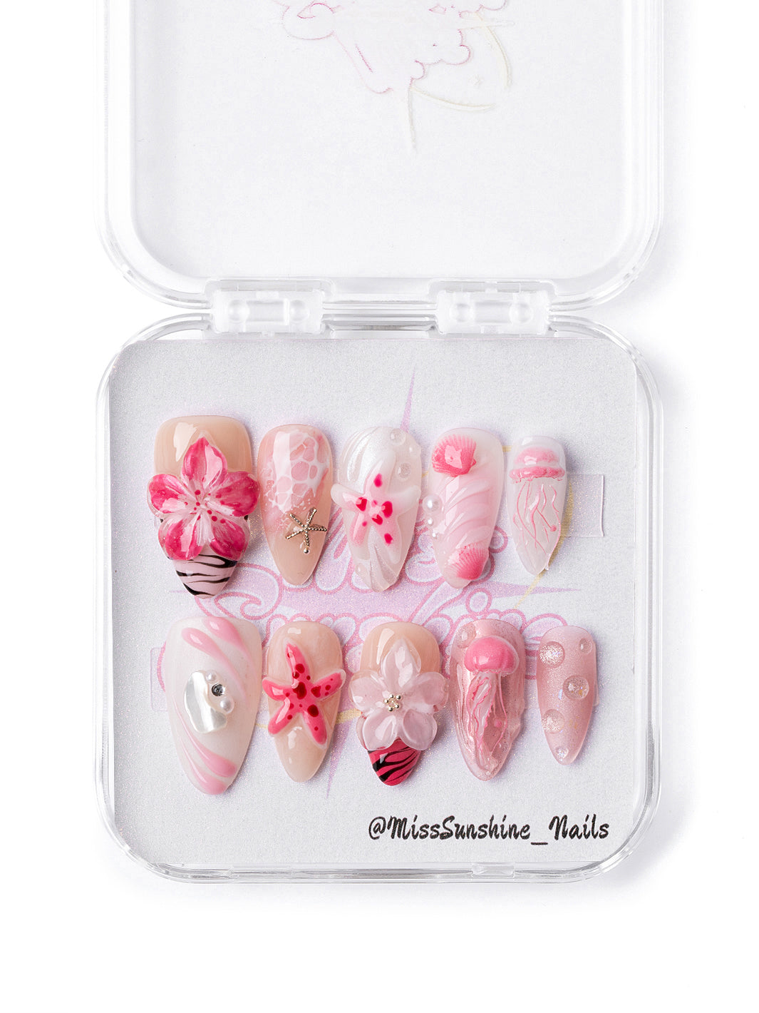 Pink Lagoon press-on nails featuring 3D jellyfish and starfish charm details
