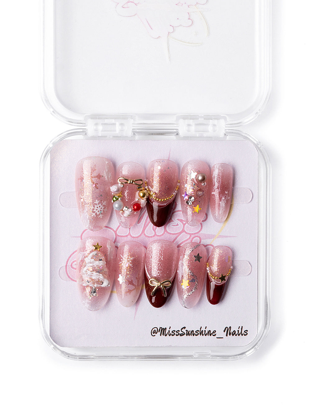 Gold charm press-on nails for winter celebrations