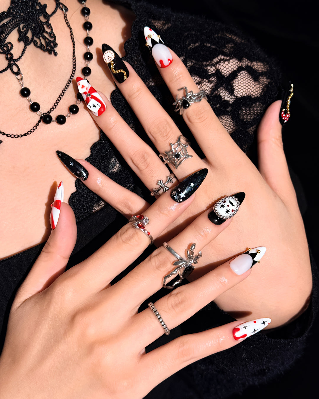 Poker Clown nail set featuring black, red, and white circus-inspired Halloween designs