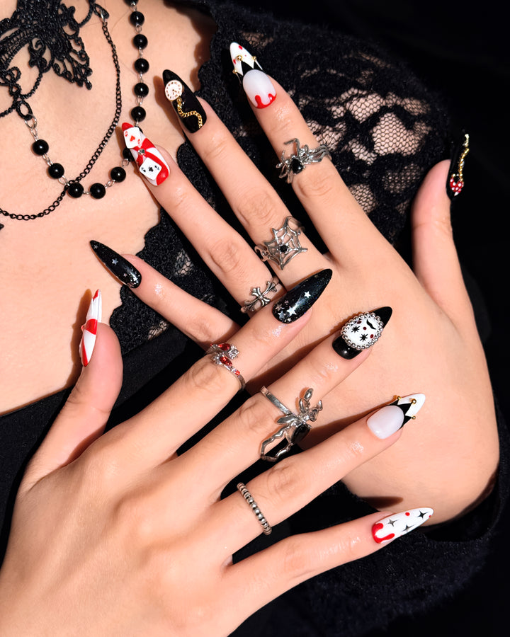 Poker Clown nail set featuring black, red, and white circus-inspired Halloween designs