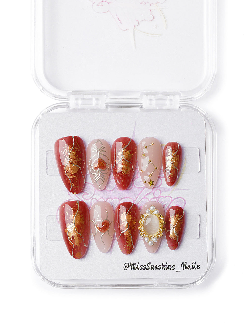 Zodiac-themed red press-ons with pearl cameo charm