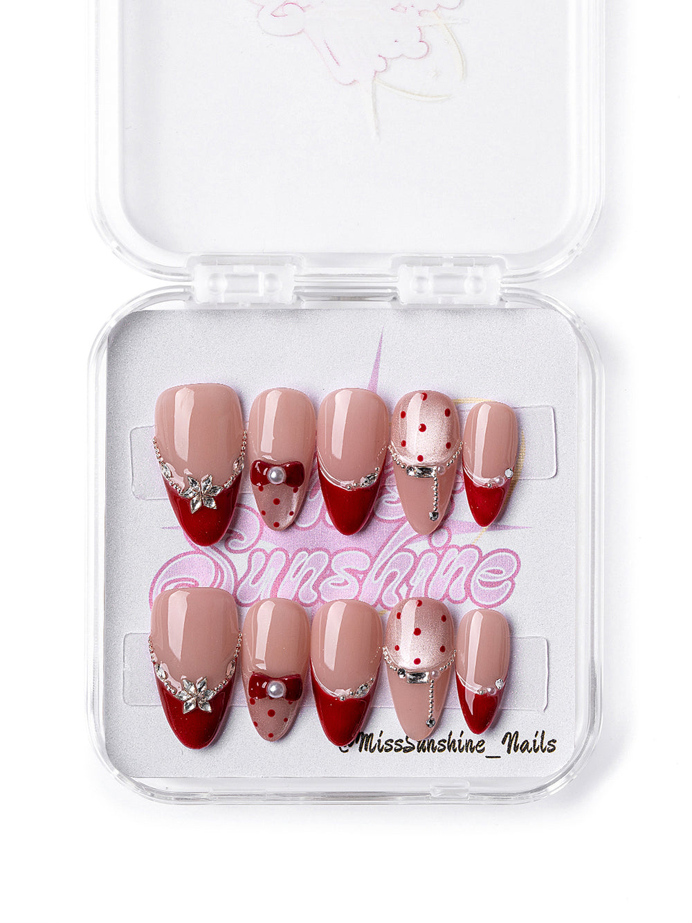 Red Lover nail set featuring polka dots, chains, and pearls