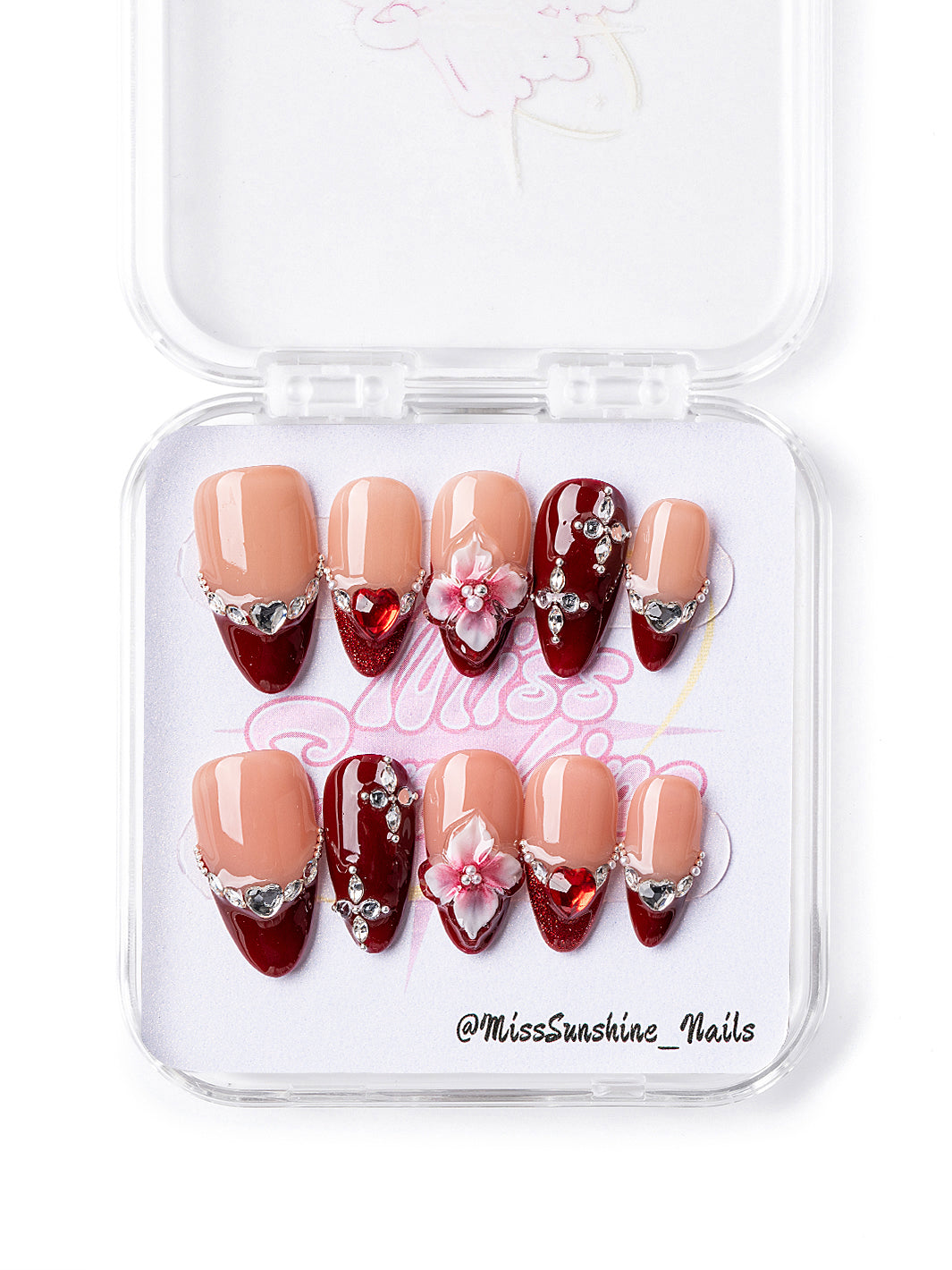 Valentine’s Day themed nails with glitter tips and silver crystals.