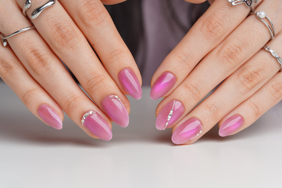 Soft pink prom nails with crystal accents