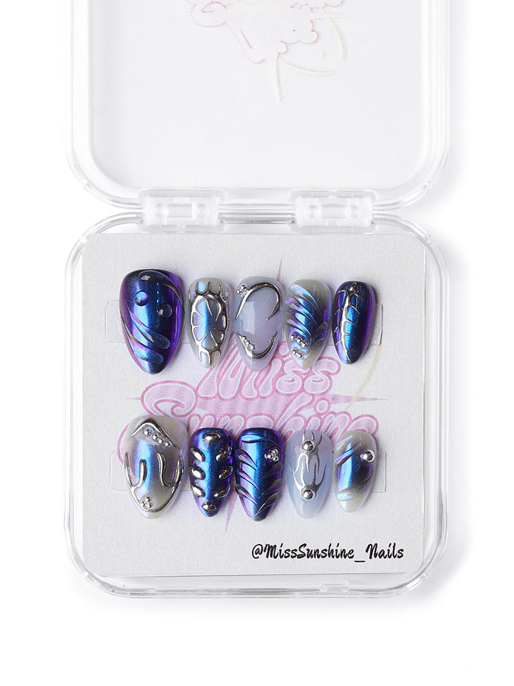 Handmade extra short almond nails with sapphire and silver chrome effect