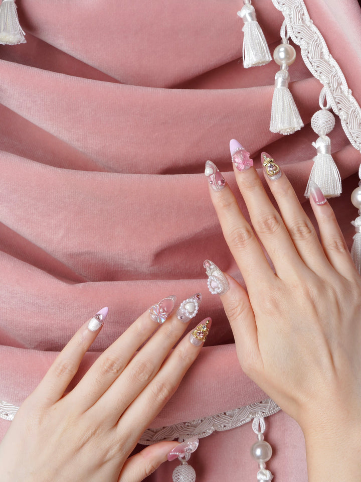 Short almond nails with romantic gem accents