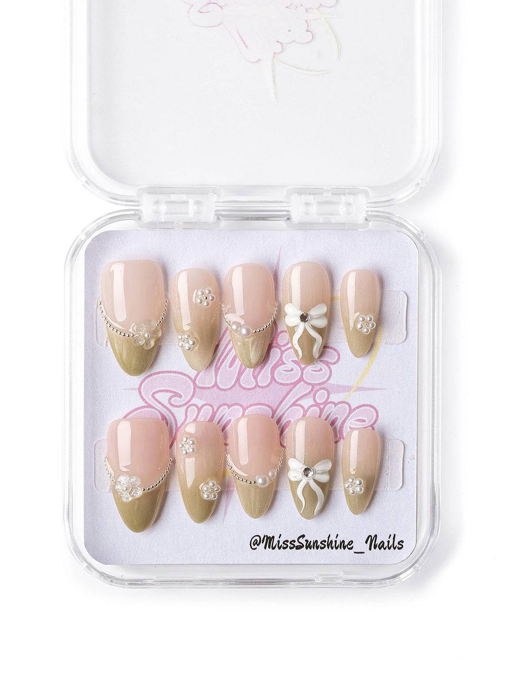 Short almond nails with 3D bows and pearls