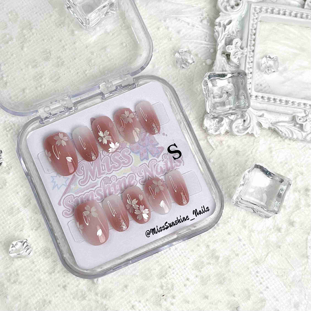 Delicate blossom nail art with subtle glitter