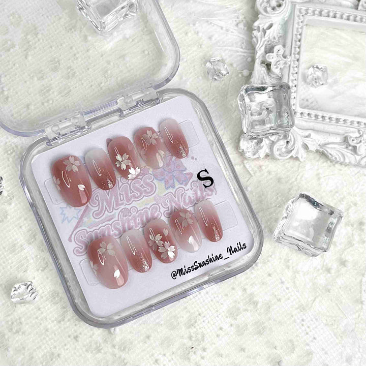 Delicate blossom nail art with subtle glitter