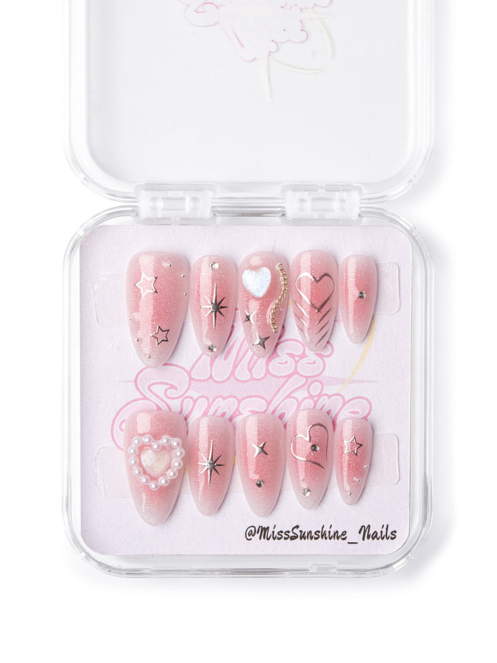 Blush nails with pearl heart and star accents