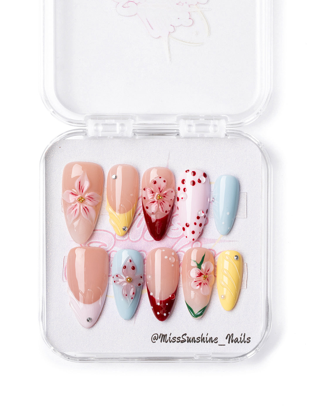 Sunset Hibiscus medium almond press-on nails with tropical flower accents and pastel colors