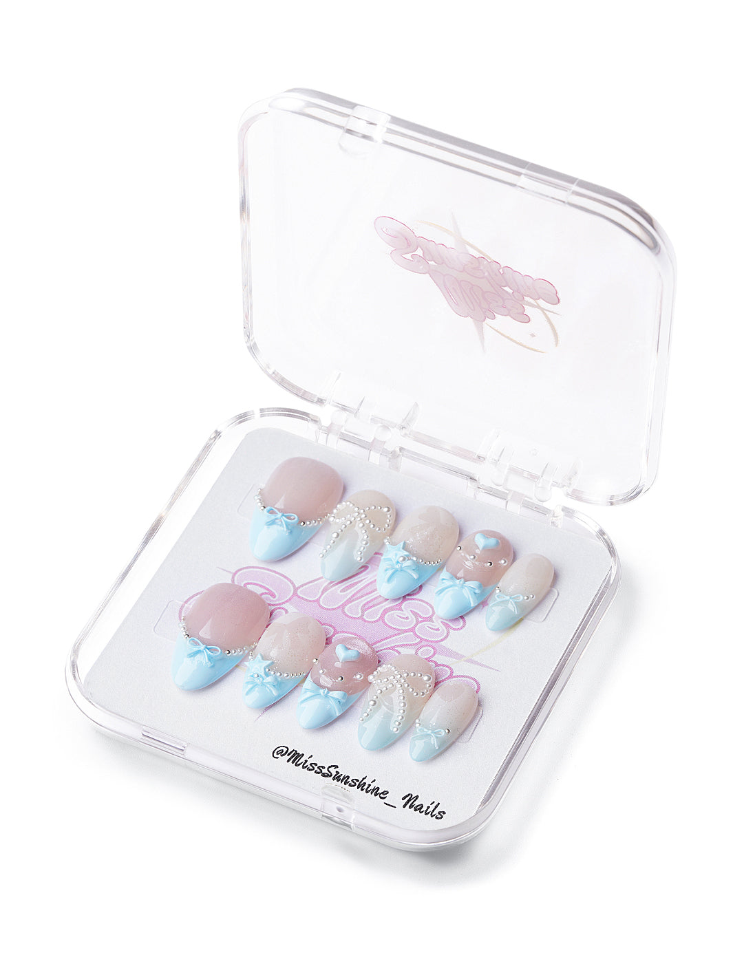 Sweet Bow short almond press-on nails with nude shimmer, baby blue French tips, pearls, and 3D bow accents