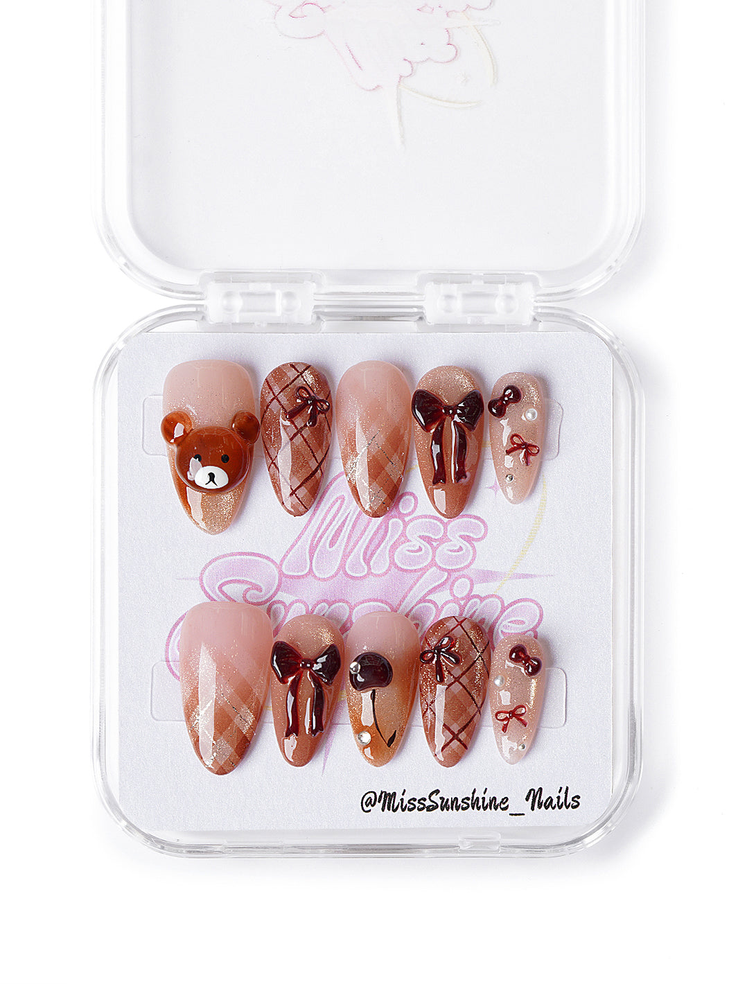 Fall-themed plaid nails with 3D bows and chocolate hearts