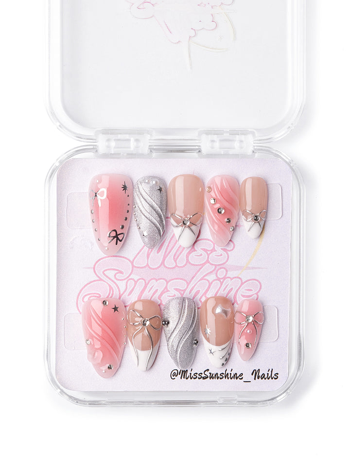 Fashion nails with 3D bows and chrome accents