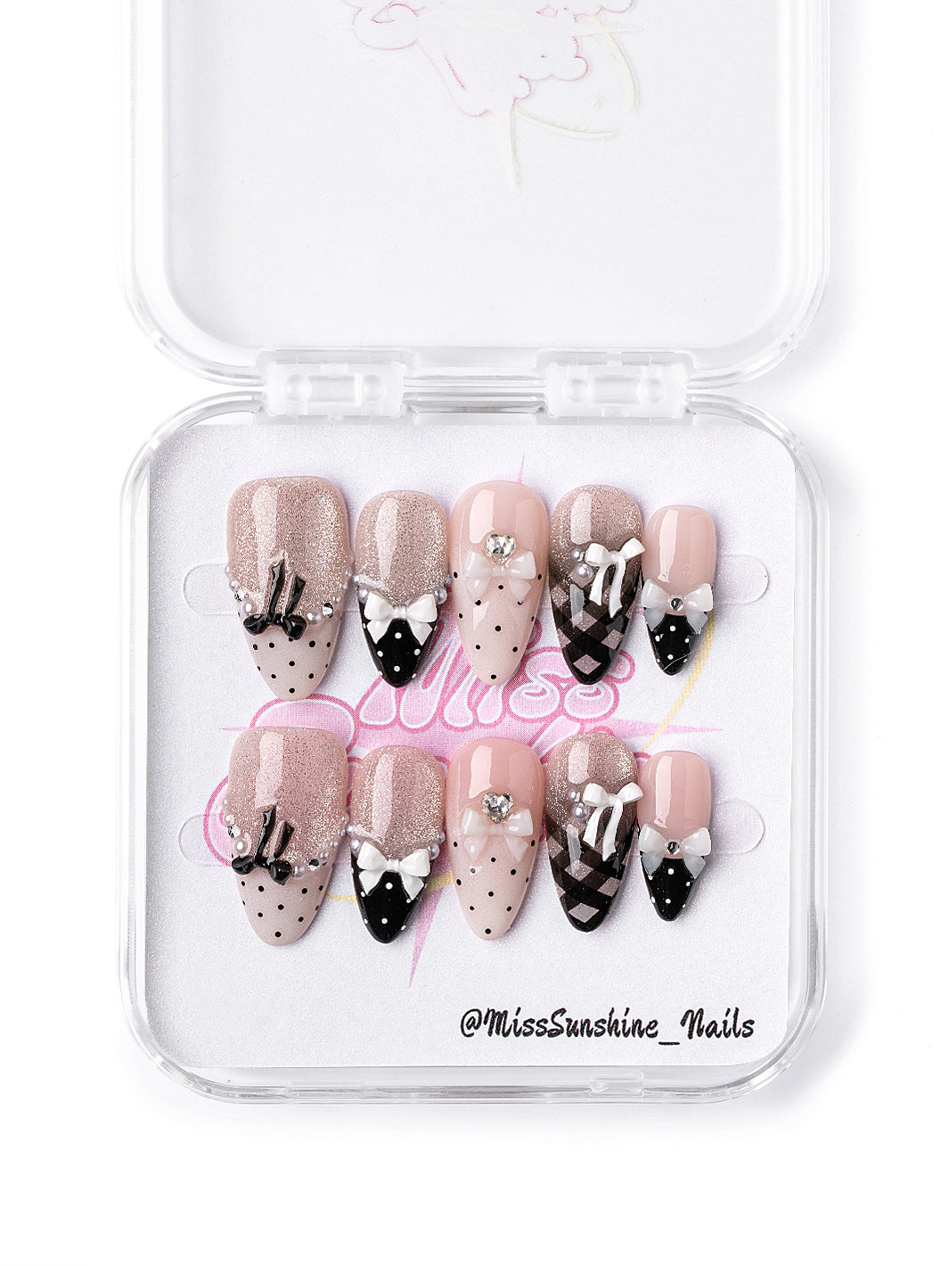 Short almond press-on nails in pink and black with bows and glitter