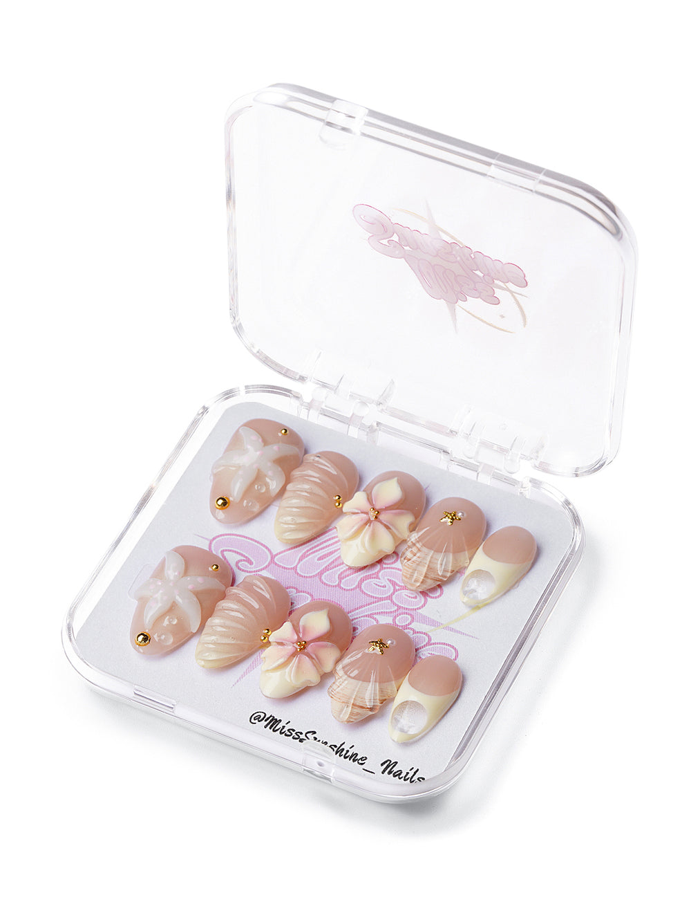Short almond nude press-on nails with 3D floral and seashell accents