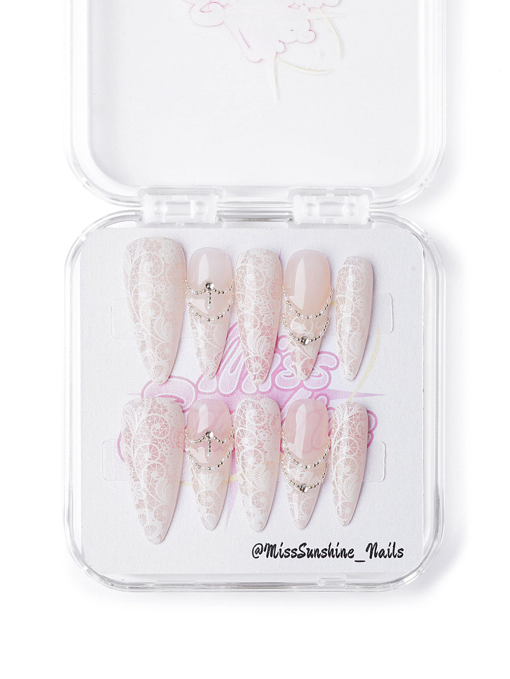 Handmade winter nail set featuring intricate lace overlays and rhinestone chain accents