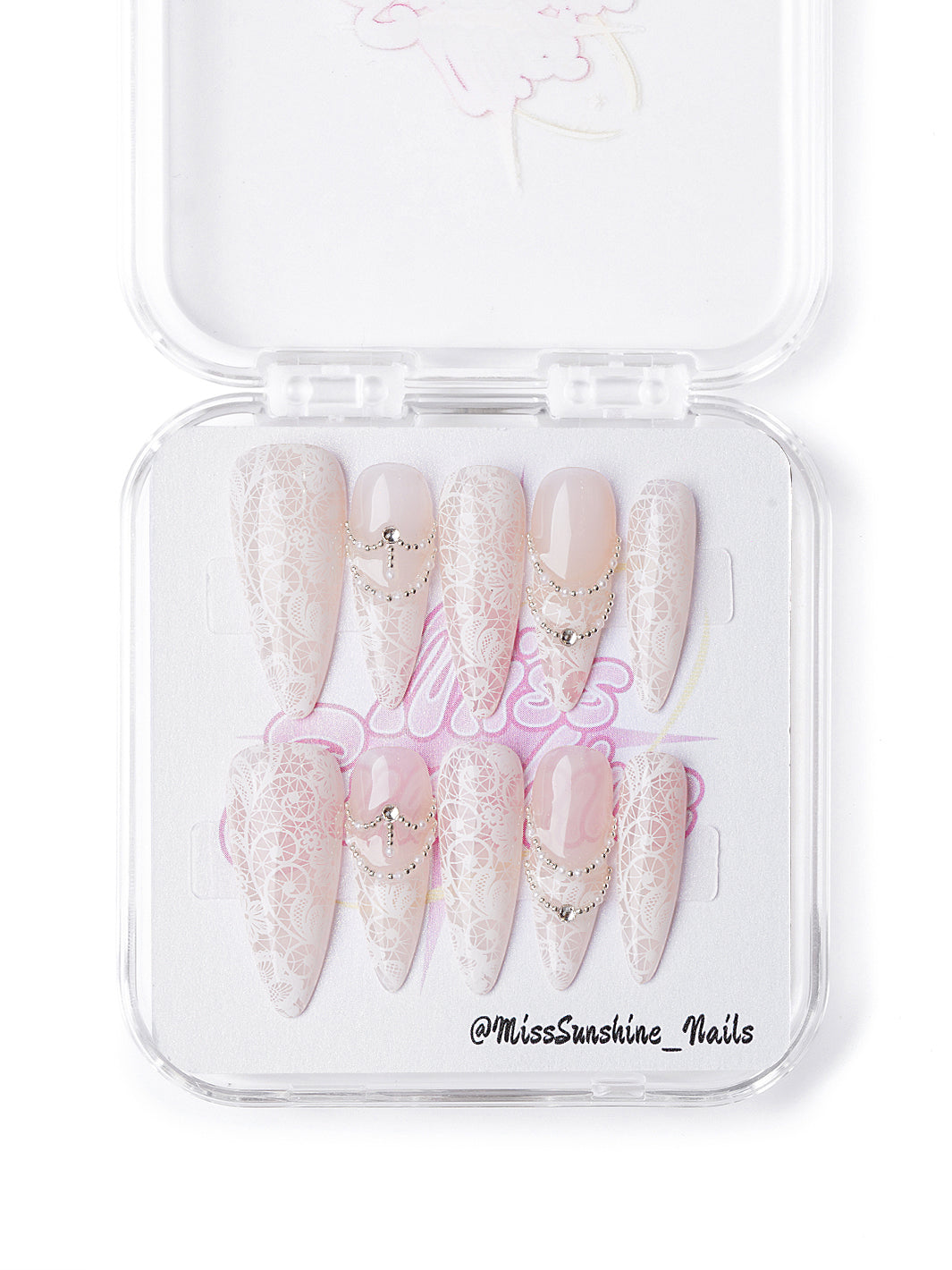 Handmade winter nail set featuring intricate lace overlays and rhinestone chain accents