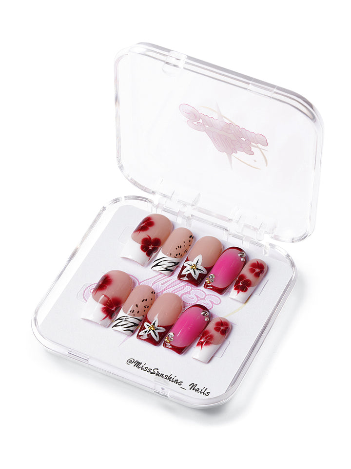 Medium square press-on nails with hibiscus flowers, zebra patterns, glitter, and bold red and nude tones
