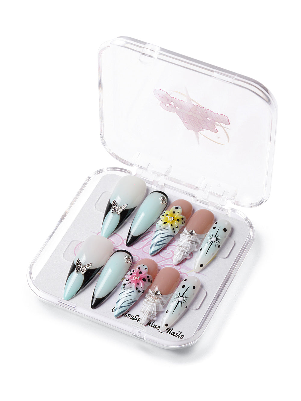 Long stiletto nails with black French tips, zebra shell patterns, and 3D lily flowers